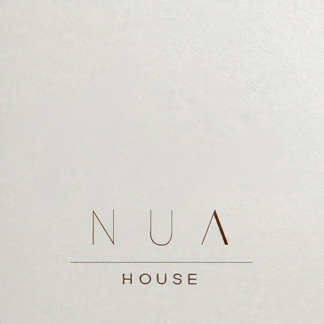 NUA House minimalist embossed letterspaced logo
